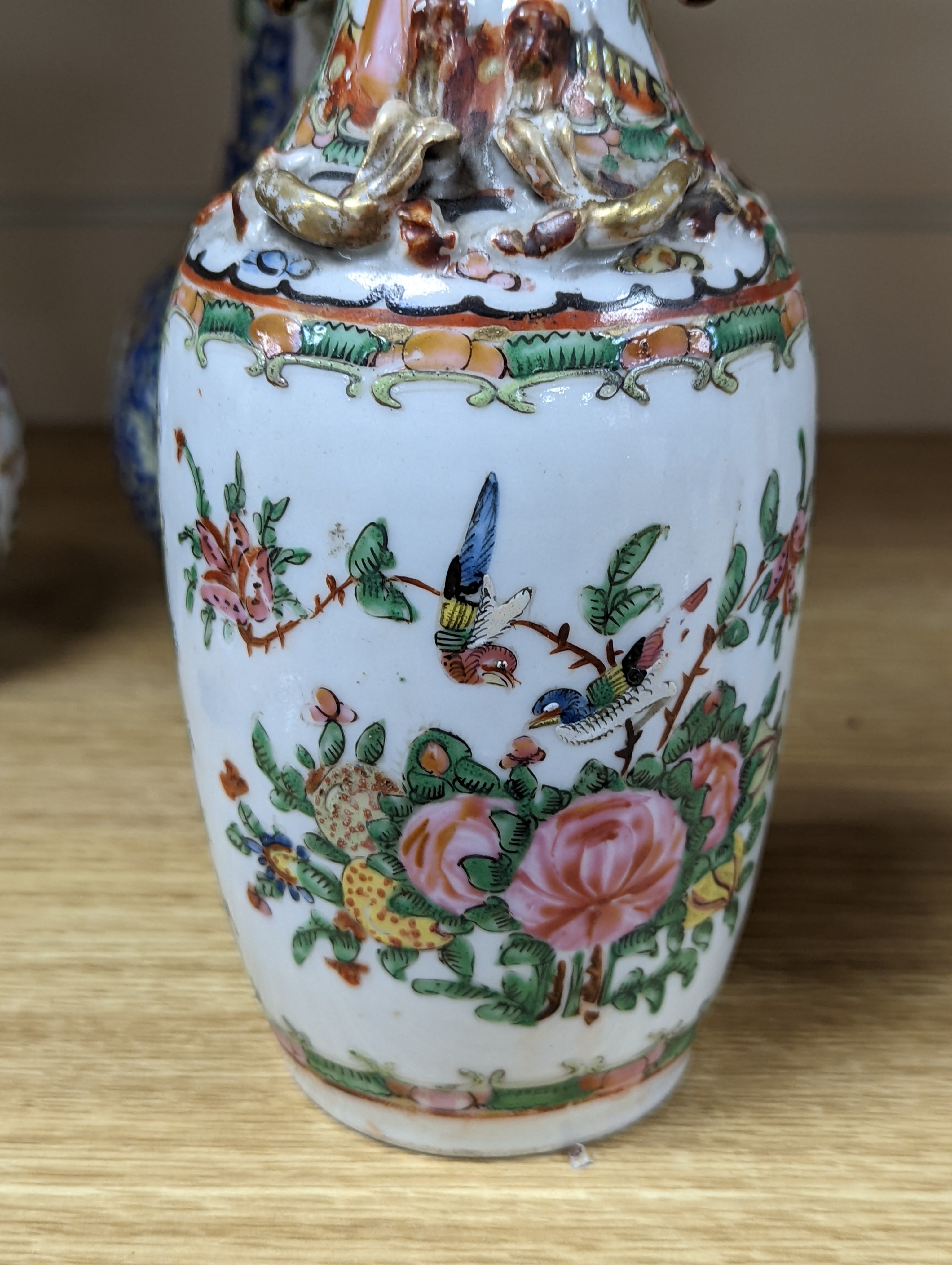 Four 19th century Chinese famille rose vases, 21cm
